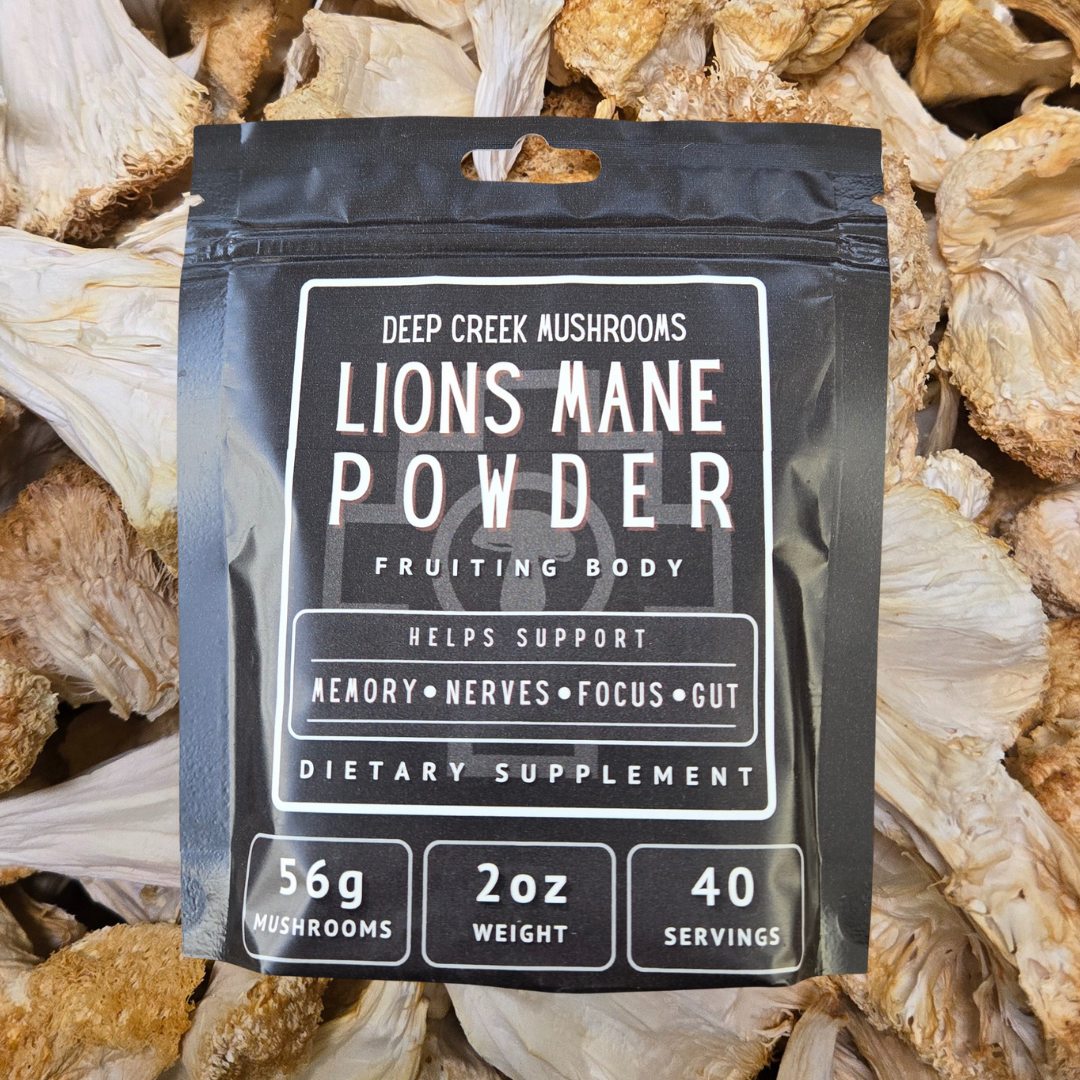 Package of Lions Mane Powder surrounded by dried mushrooms