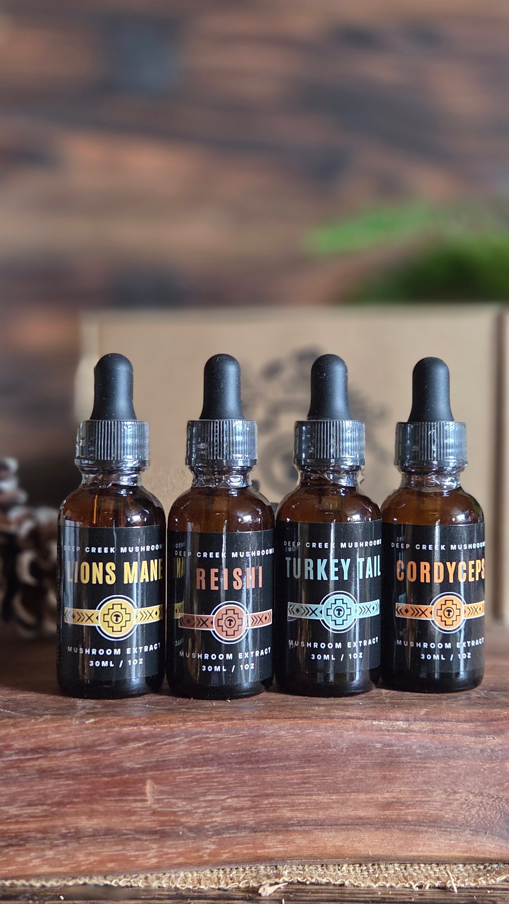 Set of mushroom tincture in a box with decorative elements on a wooden surface