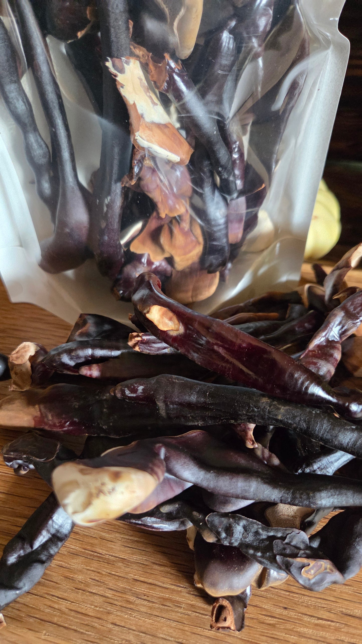 Dried Reishi mushrooms on a wooden surface with a blurred background